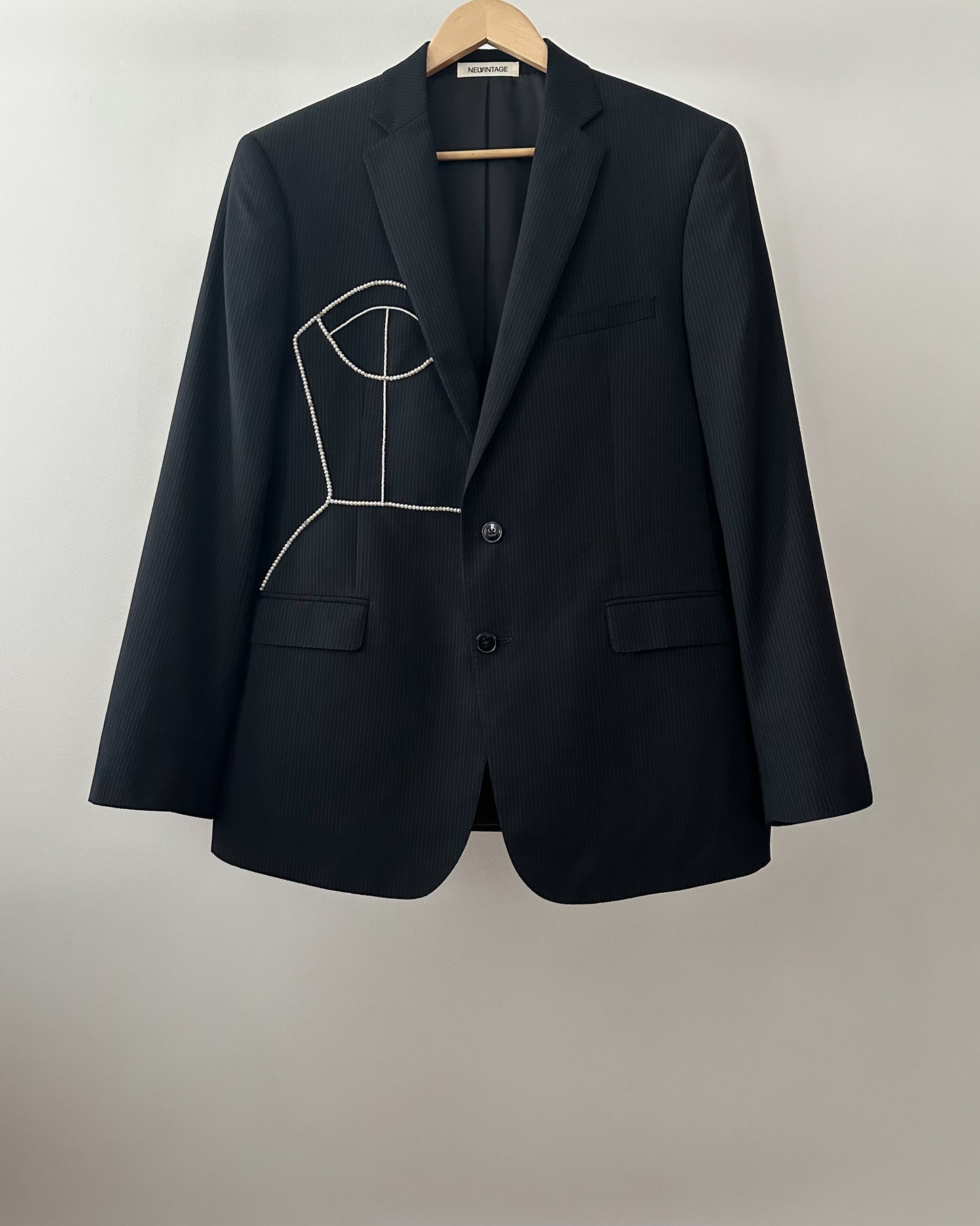BLACK PINSTRIPE WOOL BLAZER WITH HAND-BEADED CORSET DESIGN