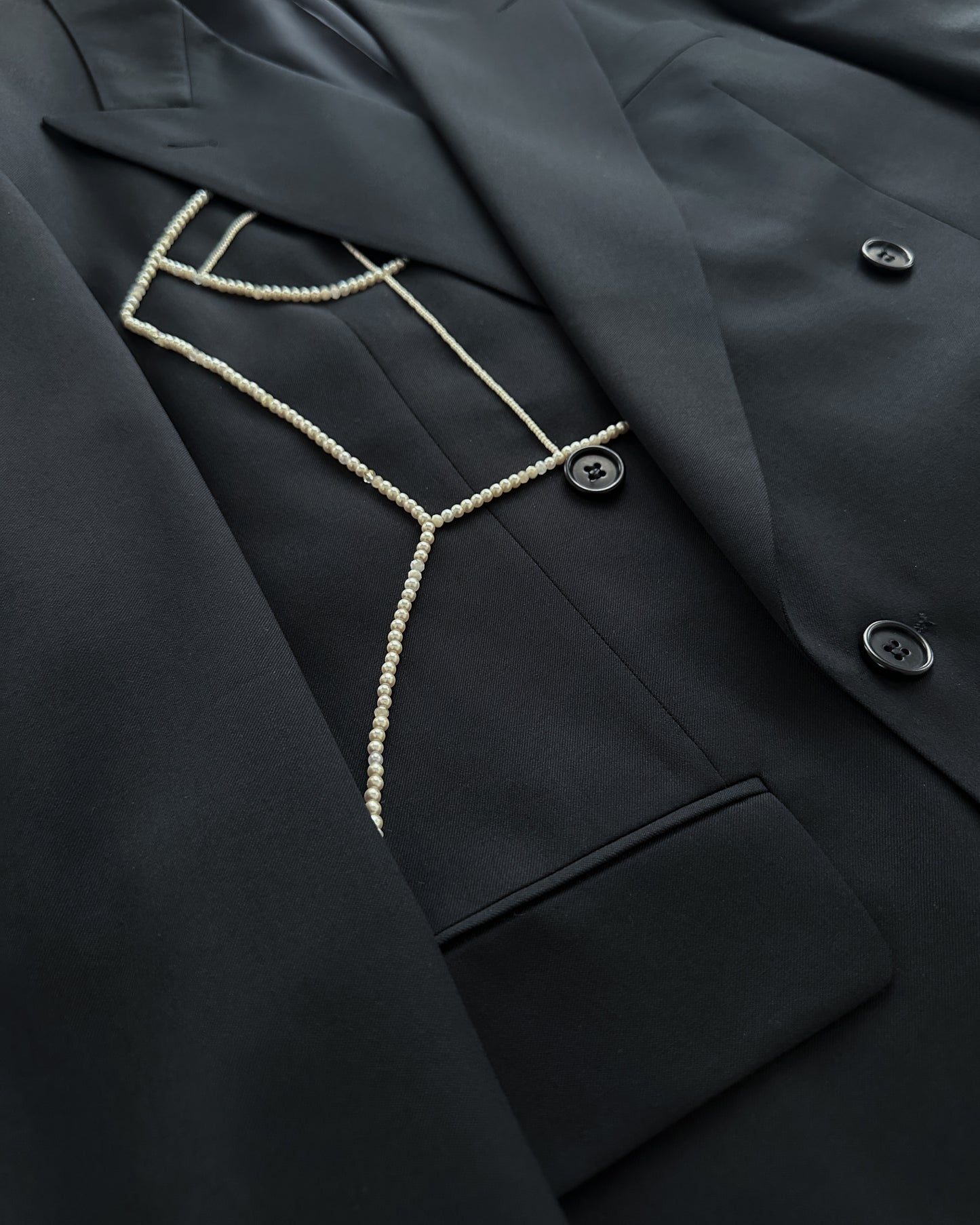 DOUBLE BREASTED WOOL BLAZER WITH HAND-BEADED CORSET DESIGN