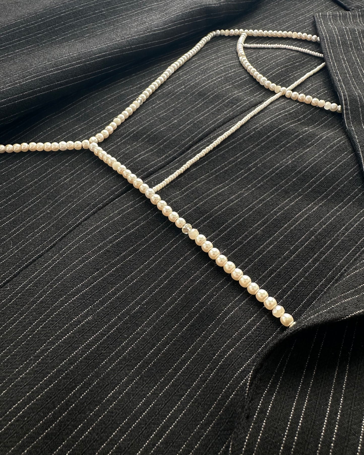 BLACK PINSTRIPE WOOL BLAZER WITH HAND-BEADED CORSET DESIGN