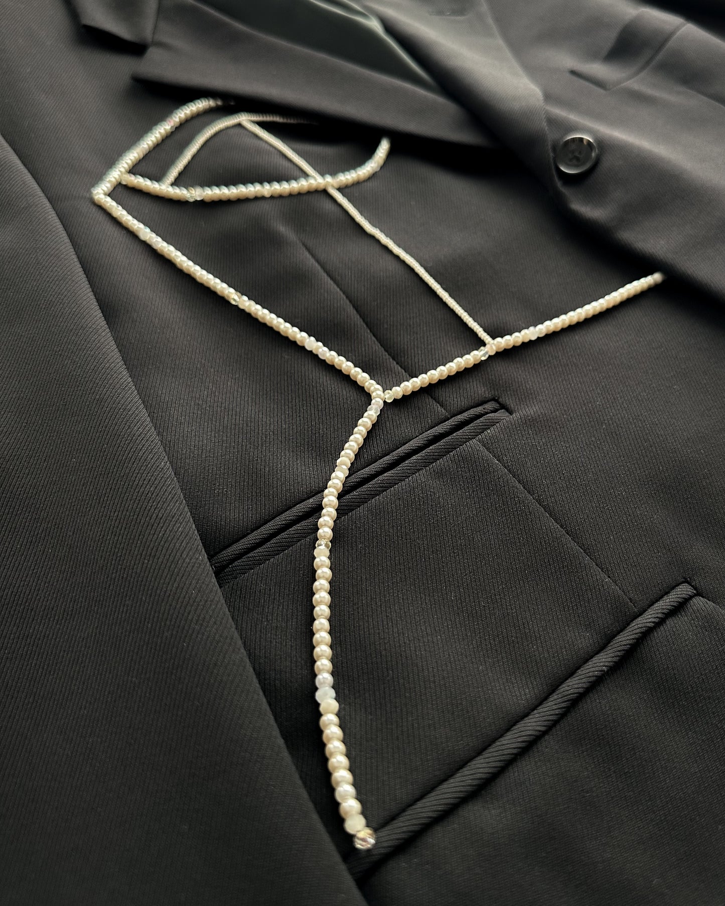 CORNELIANI BLACK MERINO WOOL BLAZER WITH HAND-BEADED CORSET DESIGN