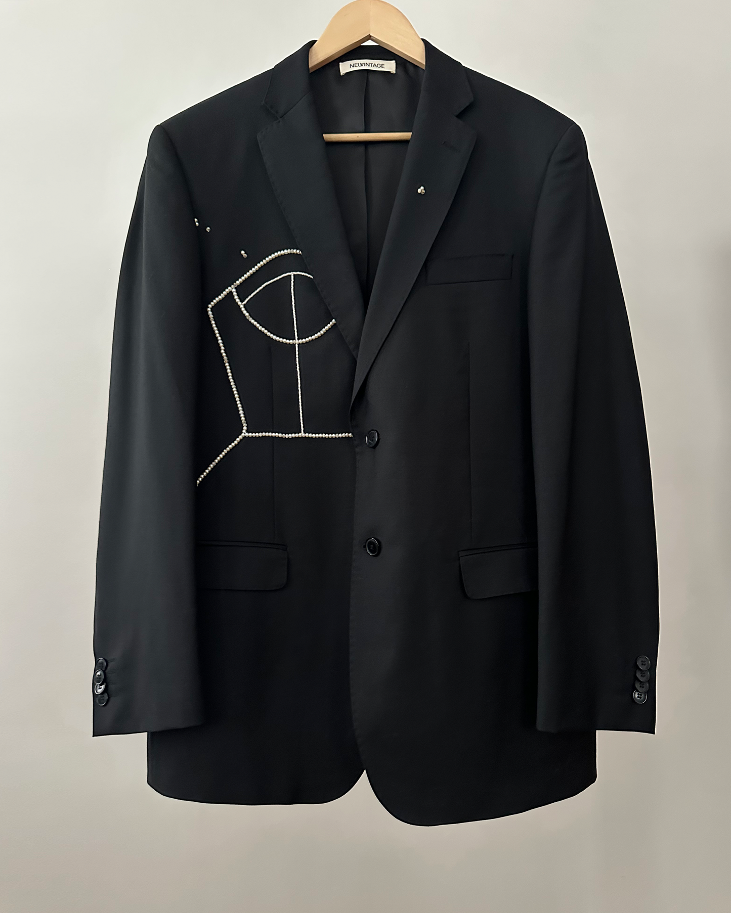 BLACK WOOL BLAZER WITH HAND-BEADED CORSET DESIGN